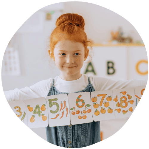 Young girl with arms outstretching holding onto a numbers chart